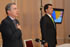 El Presidente Álvaro Uribe entona el Himno Nacional, en el inicio de la rendición de cuentas de la Consejería Presidencial para la Acción Social, este lunes en la noche. A su lado el Alto Consejero, Luis Alfonso Hoyos, Director del Programa Presidencial.